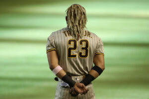 PHOENIX, ARIZONA - AUGUST 15: Fernando Tatis Jr. #23 of the San Diego Padres stands attended for the national anthem before the MLB game against the Arizona Diamondbacks at Chase Field on August 15, 2020 in Phoenix, Arizona. (Photo by Christian Petersen/Getty Images)