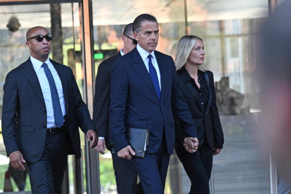 Hunter Biden (C), son of US President Joe Biden, and his wife Melissa Cohen, leave court after his guilty plea in his trail on tax evasion in Los Angeles, California, on September 5, 2024. US President Joe Biden's son, Hunter, pleaded guilty September 5, 2024 to all nine tax charges he faced, without reaching a deal with prosecutors. Before he entered the pleas in a Los Angeles court, US District Judge Mark Scarsi told him he could face up to 17 years in prison along with a $1 million fine. (Photo by Robyn Beck / AFP)