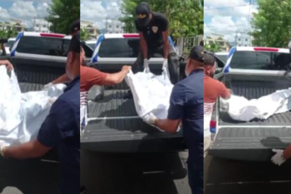 Momento en que trasladan cuerpo de hombre muerto en camioneta. Foto CDN Digital