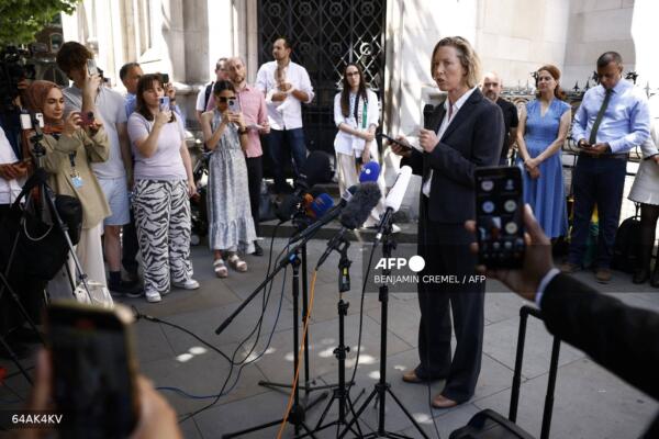 Head of UK Legal at Safe Passage International, Jennine Walker speaks to members of the media outside the Royal Courts of Justice in London on June 30, 2025, following the judgement over the UK's supply of F-35 warplane parts to Israel. The High Court in London rejected a legal challenge on Monday brought by a Palestinian group seeking to block the UK from supplying components for Israeli F-35 fighter jets. (Photo by BENJAMIN CREMEL / AFP)