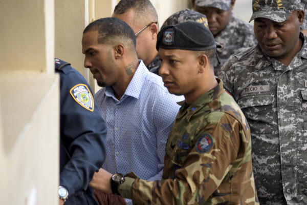 (FILES) Tampa Bay Rays Dominican baseball shortstop Wander Franco (L), who faces an accusation of molesting an underage girl, arrives in court under heavy escort in Puerto Plata, in Dominican Republic, on January 5, 2024. On June 23, 2025, the Dominican Republic's public prosecutor's office requested a five-year prison sentence for baseball player Wander Franco in the trial against him for the sexual abuse of a teenager. (Photo by AFP)