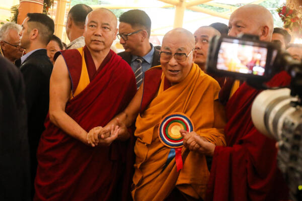 Tibetan spiritual leader the Dalai Lama (C) arrives to attend a Long Life Prayer offering ceremony at the Main Tibetan Temple in McLeod Ganj, near Dharamsala on June 30, 2025. Exiled Tibetan spiritual leader, the Dalai Lama, gave on June 30, the strongest indication yet that the 600-year-old institution would continue after his death, at prayer celebrations for his 90th birthday. The leader, who turns 90 on July 6, is according to Tibetans the 14th reincarnation of the Dalai Lama. (Photo by Sanjay BAID / AFP)