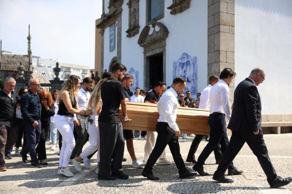 Diogo Jota's parents (L) follow the coffin of Portuguese football player Diogo Jota carried out of the church after the funeral ceremony of Liverpool's Portuguese forward Diogo Jota and his brother Andre Silva at the Mother Church of Gondomar, on the outskirts of Porto, on July 5, 2025. Liverpool forward Diogo Jota and his brother died in a car crash in Spain on July 3, 2025, sparking widespread grief just after the Portugal star had got married. (Photo by FILIPE AMORIM / AFP)