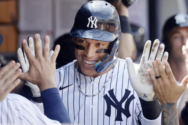 NEW YORK, NEW YORK - JULY 12: Aaron Judge #99 of the New York Yankees celebrates in the dugout after his ninth inning two run home run against the Chicago Cubs at Yankee Stadium on July 12, 2025 in New York City.   Jim McIsaac/Getty Images/AFP (Photo by Jim McIsaac / GETTY IMAGES NORTH AMERICA / Getty Images via AFP)