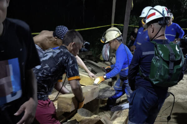 This handout picture released by the Colombian National Mining Agency shows miners working on the search operations after an accident at the 