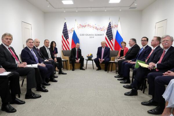(FILES) Russian President Vladimir Putin (C-L) and US President Donald Trump (C-R) hold a meeting on the sidelines of the G20 summit in Osaka on June 28, 2019. US President Donald Trump and Russian counterpart Vladimir Putin