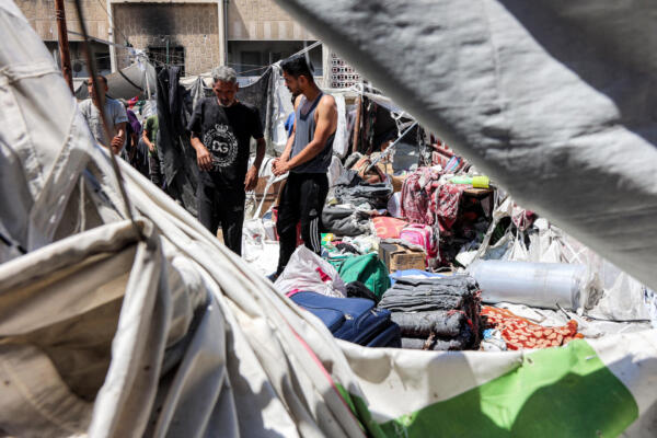 People inspect damages at a tent encampment that was sheltering displaced people, after it was hit by Israeli bombardment, near Shifa Hospital in Gaza City on September 4, 2025. The Israeli military has been gearing up to seize Gaza City, the Palestinian territory's largest urban centre, with the United Nations estimating that nearly a million people live in and around the northern city. The vast majority of Gaza's more than two million people have been displaced at least once during nearly two years of war. (Photo by Omar AL-QATTAA / AFP)