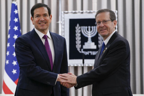 Israeli President Isaac Herzog (R) and US Secretary of State Marco Rubio shake hands ahead of their meeting at the Beit Hanassi presidential residence, during Rubio's visit in Jerusalem on September 15, 2025. US Secretary of State Marco Rubio said Washington would provide 