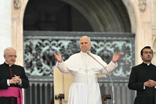 Pope Leo XIV addresses the crowd during the weekly general audience at St Peter's Square in The Vatican on October 22, 2025. (Photo by Tiziana FABI / AFP)