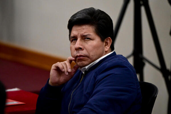 Peru's former President (20212022) Pedro Castillo gestures in the courtroom of the National Police Special Operations Directorate (DINOES) as the verdict is issued in his trial in Lima on November 27, 2025. A Peruvian court on Thursday sentenced former left-wing president Pedro Castillo to 11 years and five months in prison for trying to disband Congress and rule by decree in December 2022. (Photo by ERNESTO BENAVIDES / AFP)