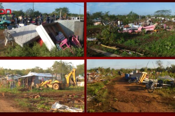 Agentes de la Fuerza Pública durante el operativo de desalojo en terrenos del Boca Chica Country Club, en el municipio de Boca Chica.