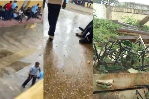 Estudiantes reciben almuerzo escolar sentados en el piso en liceo de Santo Domingo Norte