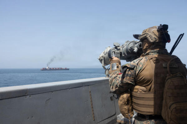 This US Navy handout photograph released on April 21, 2026, by US Central Command Public Affairs shows US forces patrolling the Arabian Sea near the Touska, an Iranian-flagged cargo ship, on April 20, 2026. Iran on April 21 called on the United Nations to condemn the seizure by the United States of an Iranian cargo ship, characterizing the move as an act of piracy and a breach of a ceasefire between Tehran and Washington. The US president announced on April 19 that the US Navy had fired on and then taken control of the Touska cargo ship in the Sea of Oman. (Photo by various sources / AFP) / XGTY / RESTRICTED TO EDITORIAL USE - MANDATORY CREDIT 