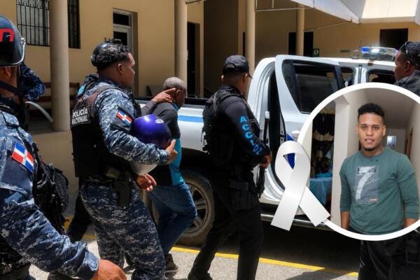 Imputado escoltado tras audiencia por asesinato en Barahona.
