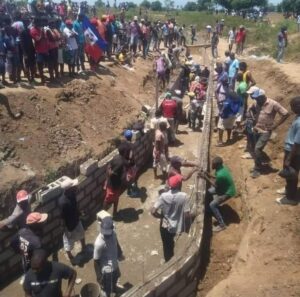 Haitianos construyen en el río masacre: 