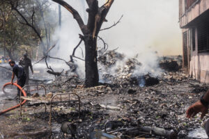 Firefighters work at the site where Air India flight 171 crashed in a residential area near the airport in Ahmedabad on June 12, 2025. The London-bound passenger plane crashed on June 12 in India's western city of Ahmedabad with 242 on board, aviation officials said in what the airline called a 