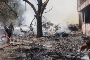 Firefighters work at the site where Air India flight 171 crashed in a residential area near the airport in Ahmedabad on June 12, 2025. The London-bound passenger plane crashed on June 12 in India's western city of Ahmedabad with 242 on board, aviation officials said in what the airline called a 